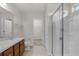 Bathroom featuring double sinks, toilet, walk-in shower and a view into an open closet at 251 Domus Ln, Casselberry, FL 32707