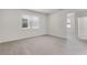 Bedroom featuring neutral walls, large window and light-colored carpet at 251 Domus Ln, Casselberry, FL 32707