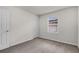Well-lit bedroom showcasing neutral carpeting and a window providing natural light at 251 Domus Ln, Casselberry, FL 32707