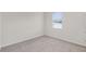 Bright, carpeted bedroom with a window providing natural light at 251 Domus Ln, Casselberry, FL 32707