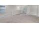 Open bonus room featuring neutral carpet, white walls, and natural light at 251 Domus Ln, Casselberry, FL 32707