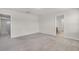 Large bonus room featuring carpet, neutral walls, and doors to adjacent rooms at 251 Domus Ln, Casselberry, FL 32707