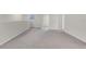 Large bonus room area featuring neutral carpet and access to various rooms at 251 Domus Ln, Casselberry, FL 32707