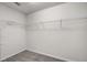 Walk-in closet featuring carpet flooring and white wire shelving at 251 Domus Ln, Casselberry, FL 32707