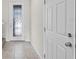 Bright entryway with decorative glass door and neutral-toned floor tiles at 251 Domus Ln, Casselberry, FL 32707