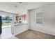 Bright kitchen featuring granite countertops, wood cabinetry and a sliding glass door at 251 Domus Ln, Casselberry, FL 32707