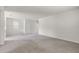 Spacious living room featuring neutral carpeting and a large window with plenty of natural light at 251 Domus Ln, Casselberry, FL 32707