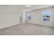 Spacious main bedroom with neutral walls, carpet, and natural light from two windows at 251 Domus Ln, Casselberry, FL 32707