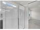 Shower with glass doors and a view to a bedroom with a window at 251 Domus Ln, Casselberry, FL 32707
