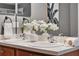 Contemporary bathroom featuring a double vanity with modern fixtures, large mirrors, and white accents at 2563 Breezy Meadow Rd, Apopka, FL 32712