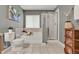 Bright bathroom featuring a shower with glass enclosure, soaking tub, and neutral wall color at 2563 Breezy Meadow Rd, Apopka, FL 32712