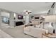 Spacious living room boasts neutral colors, fireplace, and a comfortable sectional sofa at 2563 Breezy Meadow Rd, Apopka, FL 32712