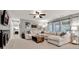 Inviting living room with a plush sectional sofa, modern decor, and neutral tones at 2563 Breezy Meadow Rd, Apopka, FL 32712