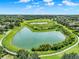 Aerial view of lush neighborhood, showcasing scenic ponds and green spaces, perfect for outdoor enjoyment at 2563 Breezy Meadow Rd, Apopka, FL 32712