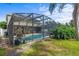 Exterior view of pool area and screen enclosed outdoor space at 2850 Spring Heather Pl, Oviedo, FL 32766