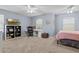 Bedroom featuring a comfortable bed, a desk area, and a ceiling fan at 2850 Spring Heather Pl, Oviedo, FL 32766