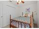 Comfortable bedroom features a four-poster bed, artwork, and closet for ample storage at 2850 Spring Heather Pl, Oviedo, FL 32766