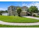 Charming two-story home with a well-manicured lawn and a paved driveway leading to an attached two-car garage at 2850 Spring Heather Pl, Oviedo, FL 32766