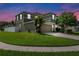 Charming two-story home with a well-manicured lawn and a paved driveway leading to an attached two-car garage at 2850 Spring Heather Pl, Oviedo, FL 32766