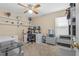 Spacious home office includes a work desk, monitors, and built-in shelves for storage at 2850 Spring Heather Pl, Oviedo, FL 32766