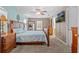 Spacious main bedroom with a ceiling fan, a television, and ample natural light at 2850 Spring Heather Pl, Oviedo, FL 32766