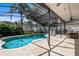 Sparkling pool with a screened enclosure, offering a private and relaxing outdoor space at 2850 Spring Heather Pl, Oviedo, FL 32766