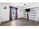 Bedroom features hardwood floors, modern ceiling fan, large windows, and plenty of natural light at 2908 Clear Way, Orlando, FL 32805