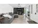 Open-concept living room with plush sectional, modern lighting, and a large TV for Gathering enjoyment at 2908 Clear Way, Orlando, FL 32805