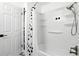 Clean shower with white tile surround, rainfall shower head, and glass door at 2908 Clear Way, Orlando, FL 32805