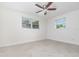 Bright bedroom with large windows and tile flooring at 323 Scotland Dr, Daytona Beach, FL 32117