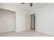 Bedroom featuring tile floors, a ceiling fan, and closet at 323 Scotland Dr, Daytona Beach, FL 32117
