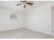 Bright bedroom featuring tile floors, a ceiling fan, and one window at 323 Scotland Dr, Daytona Beach, FL 32117