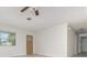 Bright living room featuring neutral walls and tile floors at 323 Scotland Dr, Daytona Beach, FL 32117