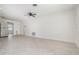 A spacious living room with tile flooring open to the kitchen area at 323 Scotland Dr, Daytona Beach, FL 32117