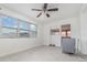 Room featuring tile floors, a ceiling fan, and large window at 323 Scotland Dr, Daytona Beach, FL 32117