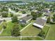 Aerial view showcasing the home, neighborhood, and nearby lake at 352 Giovani Blvd, Clermont, FL 34715