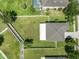 Aerial view of the expansive backyard with a pool and a privacy fence at 352 Giovani Blvd, Clermont, FL 34715