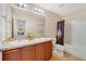 Bathroom featuring double sinks and a shower-tub combo at 352 Giovani Blvd, Clermont, FL 34715