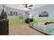 Bright bedroom with a desk by the window and playful decorations at 352 Giovani Blvd, Clermont, FL 34715
