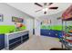 Colorful bedroom featuring bunkbed, blue and green walls, desk, and drawers for storage at 352 Giovani Blvd, Clermont, FL 34715