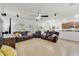 Spacious living room with tile flooring, ceiling fan, and a comfortable seating area for entertaining at 352 Giovani Blvd, Clermont, FL 34715