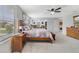 Bright main bedroom featuring a sitting area, large windows, and light-colored walls at 352 Giovani Blvd, Clermont, FL 34715