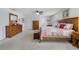 A well-lit main bedroom features an expansive layout with light-colored walls and soft carpeting at 352 Giovani Blvd, Clermont, FL 34715