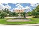 Community pool with lounge chairs and umbrellas on a sunny day at 352 Giovani Blvd, Clermont, FL 34715