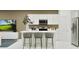 Modern kitchen features white cabinets, stainless appliances, and a central island with seating at 367 Sol Vista Dr, Dundee, FL 33838