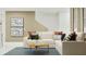 Cozy living room with a comfortable sofa, stylish decor, and ample natural light at 367 Sol Vista Dr, Dundee, FL 33838