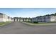 New Townhome community features modern exteriors, sidewalks and attached garages at 367 Sol Vista Dr, Dundee, FL 33838
