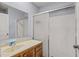 Bathroom featuring a sliding glass door shower, neutral counter tops, and vanity at 3946 Versailles Dr # 3946B, Orlando, FL 32808