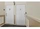 Two condominium unit doors with visible unit numbers, accented by wall trim at 3946 Versailles Dr # 3946B, Orlando, FL 32808