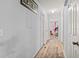 A bright hallway features light blue walls and modern wood-look flooring at 3946 Versailles Dr # 3946B, Orlando, FL 32808